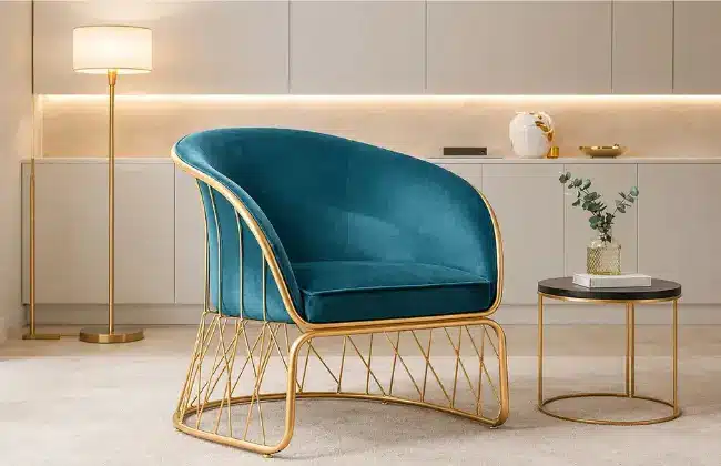 Cozy Curve Gold Frame Iron Lounge Chair in a modern living room with elegant gold accents